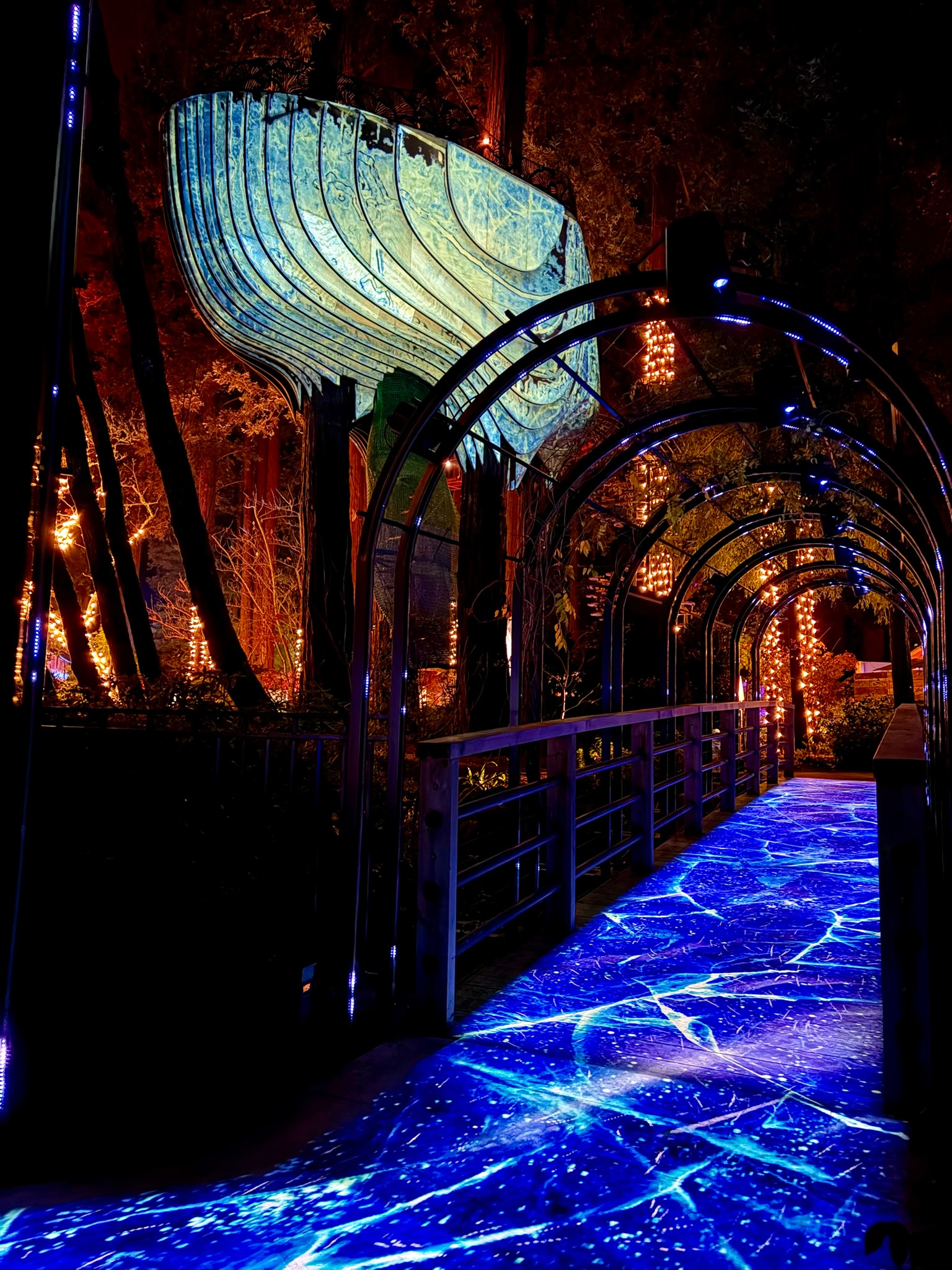 Redacted Residence projection-mapped treehouse and illuminated walkway